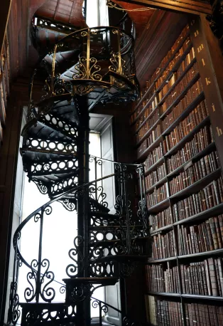 The library in Dublin, picture shows metal staircase and lots of books.